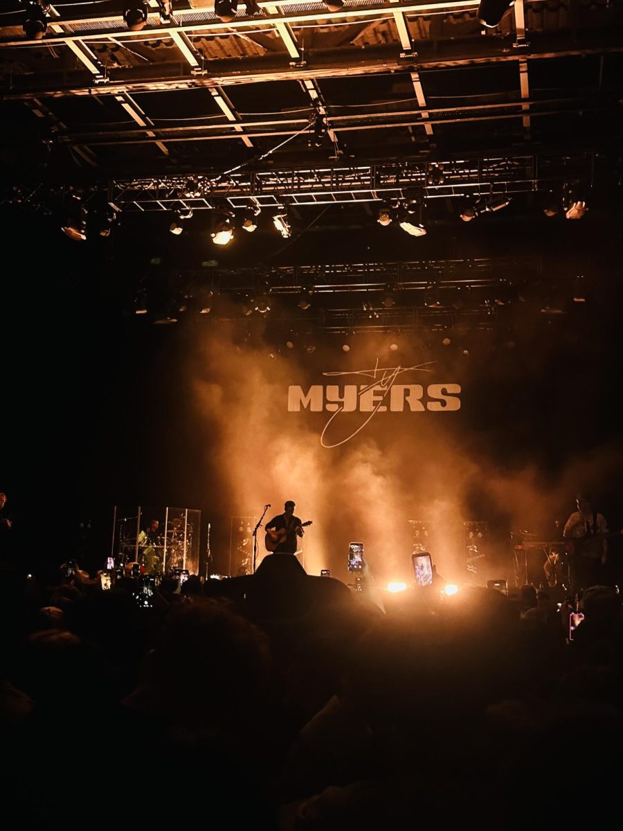 Ty Myers takes the stage to perform an unreleased song, “Good Morning Paris,” on his new album, “Heavy On the Soul,” that comes out March 27. Fog machines surrounded the stage and released smoke to add to the special effects.