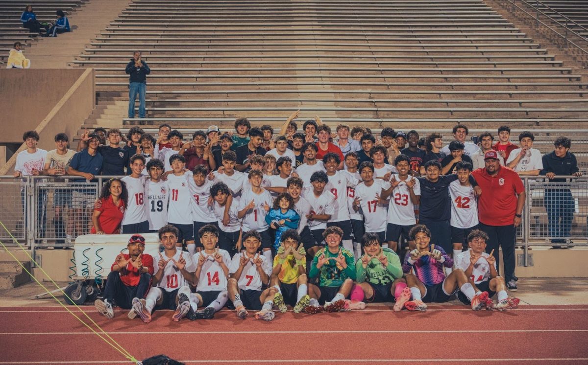 The Bellaire Varsity Boys Soccer team pose together at the end of the game. This is the first time they will advance to the regional semifinals since 1998.