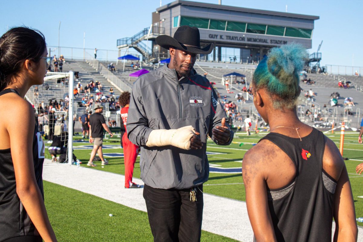 Just minutes before the 300-meter hurdles, McTear shares last-minute advice on how to attack the curve while maintaining momentum. On Feb. 27, the girls track team competed at the LCISD meet in Rosenberg, Texas, earning three relay golds and two individual titles.