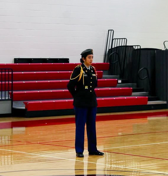Mendieta stands dressed in the official JROTC uniform. Uniforms within the program were decided through promotion tests and the rank of an individual. 