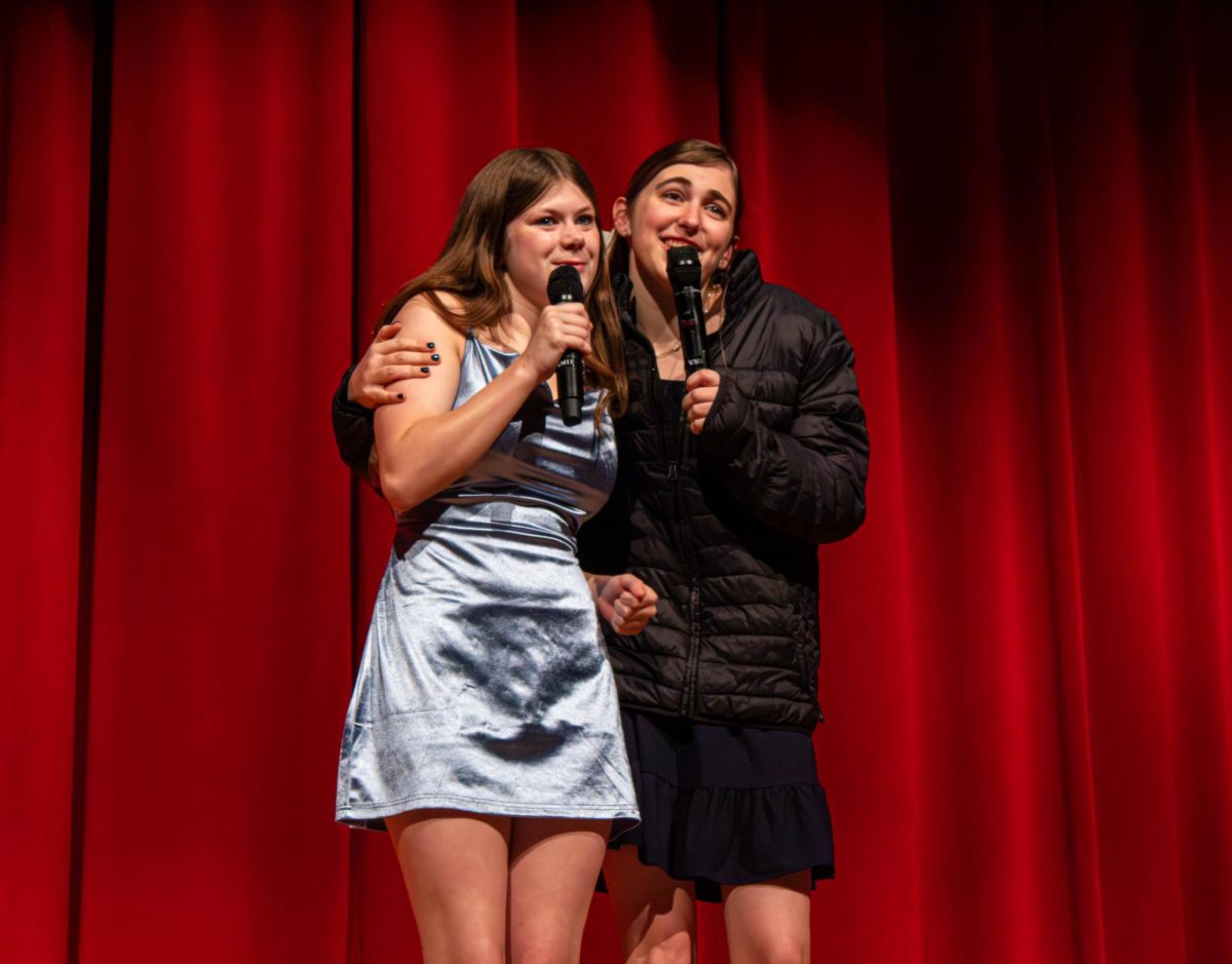  Varsity Red Bird Productions (RBP) members and juniors Audrey Lawrence and Sierra Little embrace each other while singing “End of the Line” from the musical “Theory of Relativity” by Neil Bartram. “Towards the end, I hoped we woke the audience up, got a few laughs and gave them joy,” Little said. “I hope they walked away thinking that was a funny show.”