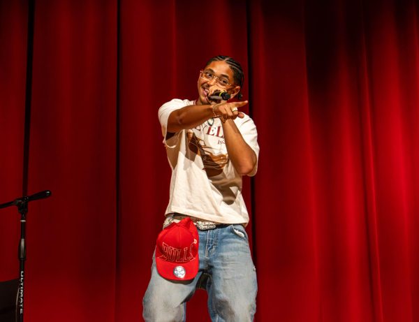 Sophomore Yousany Keyklyn Grenot points toward the audience while performing. Grenot sang “Just the Two Of Us” by Bill Withers, Ralph MacDonald and William Salter and “Shallow” by Lady Gaga, Mark Ronson, Anthony Rossomando and Andrew Wyatt.