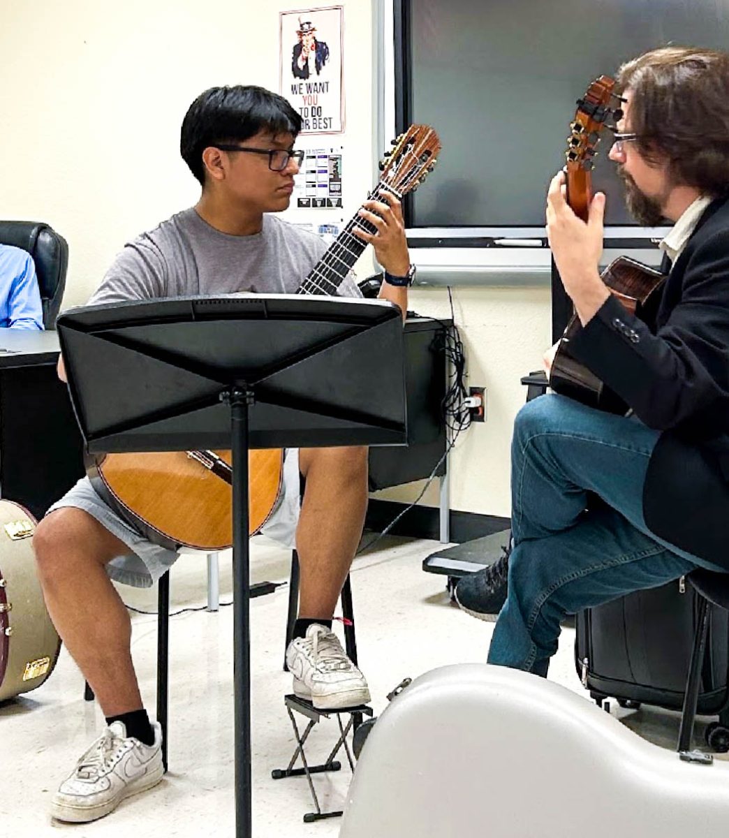 Senior Ismael Moo-Quevedo plays in a master class with Chad Ibison from the Ibison Guitar Duo. Moo-Quevedo participated in the class during his freshman year at the annual Hill Country Classical Guitar Ensemble Festival and Competition at San Marcos, where he received feedback on his solo songs.