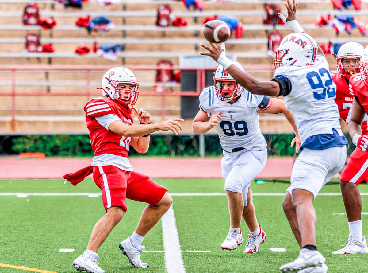 Burleigh quickly throws the ball over the hand of a Lamar defensive player. Burleigh completed six touchdown passes this season over the eight games he played. 