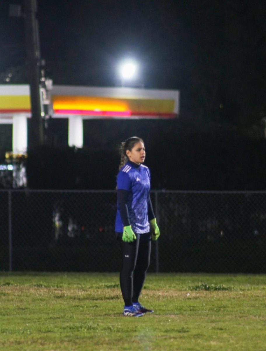 Cortez stands as goalie in the first game of her freshman season. Cortez was at KIPP Houston High School her freshman year before she transferred to Bellaire.