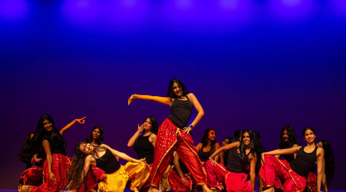 Maahi Vaswani poses at center stage during Bellaire Bollywood Club’s third dance. The choreography was an Indian hip-hop fusion to a mashup of “Titi Me Pregunto” by Bad Bunny and “Saki Saki” by Neha Kakkar.