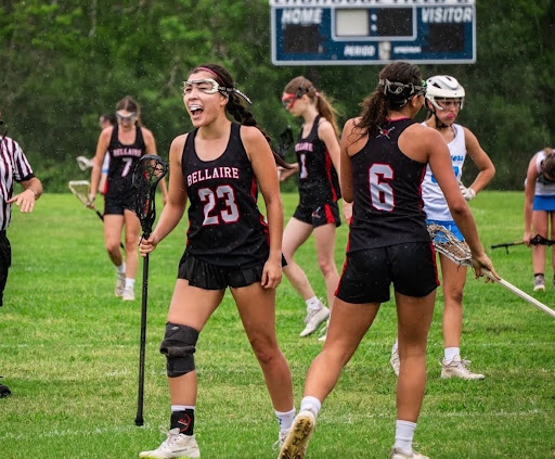 Flannigan celebrates with her team after a win against Clear Springs last year. Flannigan wore a knee brace as support after an injury.