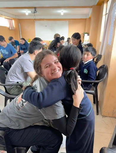 In the high altitudes of Guamote, Ecuador, Alcanter shares the gospel while taking time to wash the children's feet and offers them new boots to combat the rainy seasons. She chose to go on a mission trip for her senior year during spring break with her church.