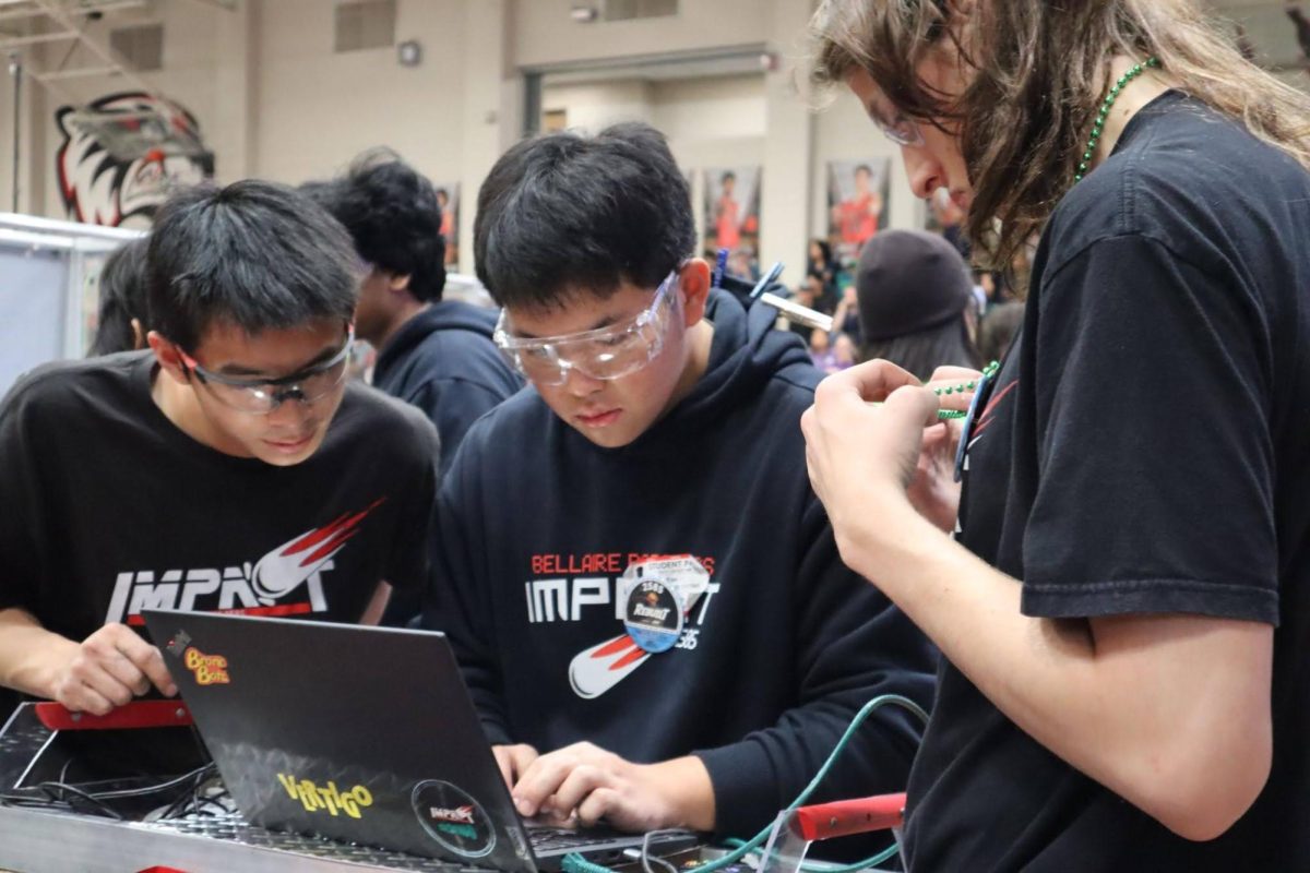 Senior and program lead Kevin Yan debugs between matches at the FIRST in Texas Space City robotics competition on April 4. The two-day competition ended with the team placing 16th out of 34 teams.