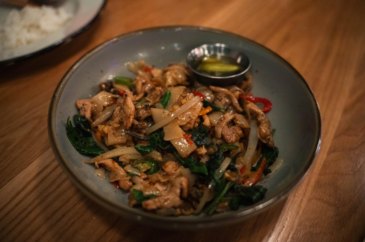 Drunken noodles, a popular post-drinking meal intended to sober up the individual, are garnished with chili oil and lime. Our waiter recommended that we thoroughly mix the dish as the chili oil, the main contributor of spice, floated above the noodles.