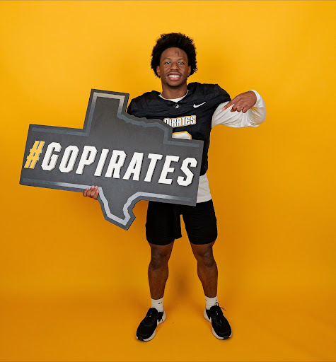 Senior Anthony Miller wears a Southwestern University football jersey while posing for his college commitment photoshoot. Miller posted an array of photos from this photoshoot on his Instagram account.