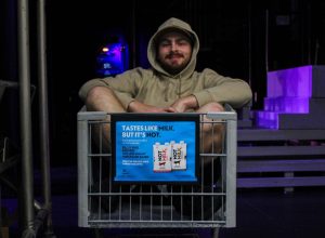 Manne sits inside the shopping cart he and Madelyn found when he was a freshman. The shopping cart has been used to aid in the production of all UIL One-Act-Play shows since then.
