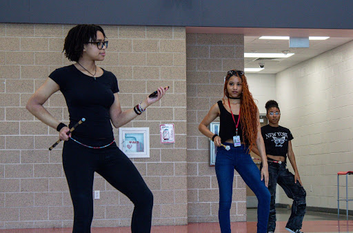 Horn demonstrates a move during the dance. Twirling Club will perform to the song "Beat It" by Michael Jackson at the Houston NAMIWalks walkathon.